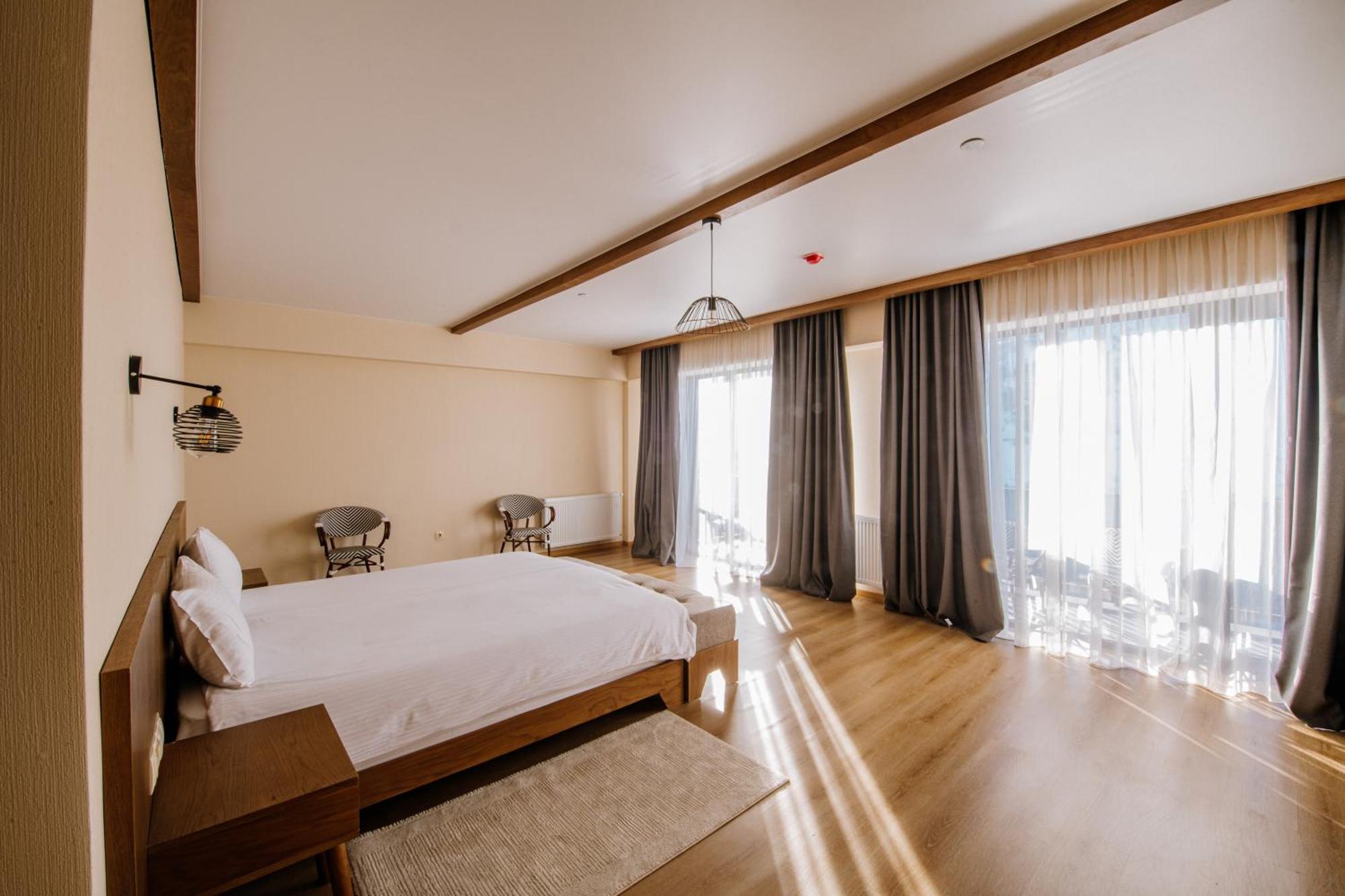 Gudauri Inn Quarto foto A bedroom at the hotel